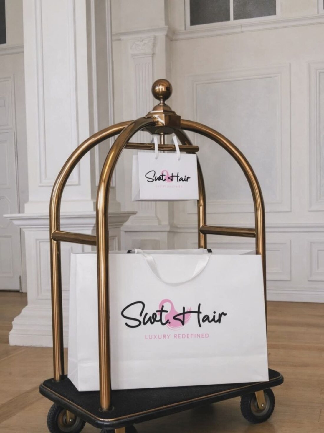 Signature Swt. Hair shopping bags on a gold luggage cart